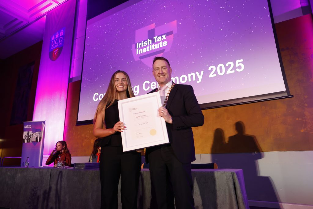 Sophie Hartigan receiving her Third-Level Scholarship from President Shane Wallace