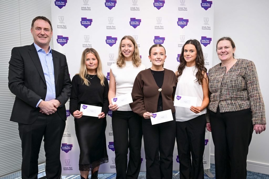 Photo of 3rd Place Fantasy Budget team from University of Galway in front of the Irish Tax Institute logo