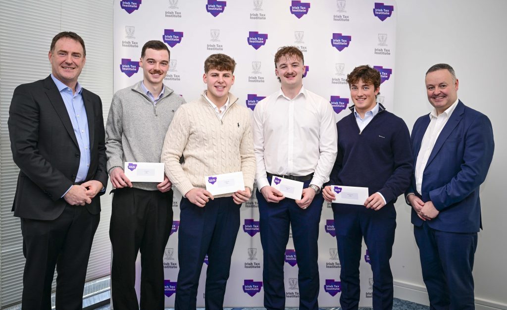 Photo of 2nd Place Fantasy Budget team from DCU in front of the Irish Tax Institute logo