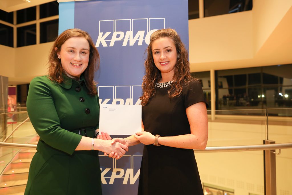 Claire Doyle receiving the prize for Exceptionally High Marks at Part 2 Business Taxes, from Catríona Buckley, Director, Tax, KPMG.