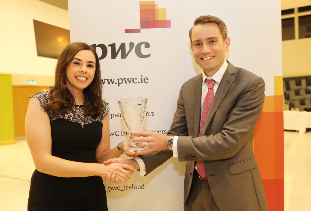 Martha McCormack receiving the Sean Cleary Memorial Prize for outstanding marks in Part 3 Advanced Direct Tax International Exam from Colm O’Callaghan, Partner, PwC.