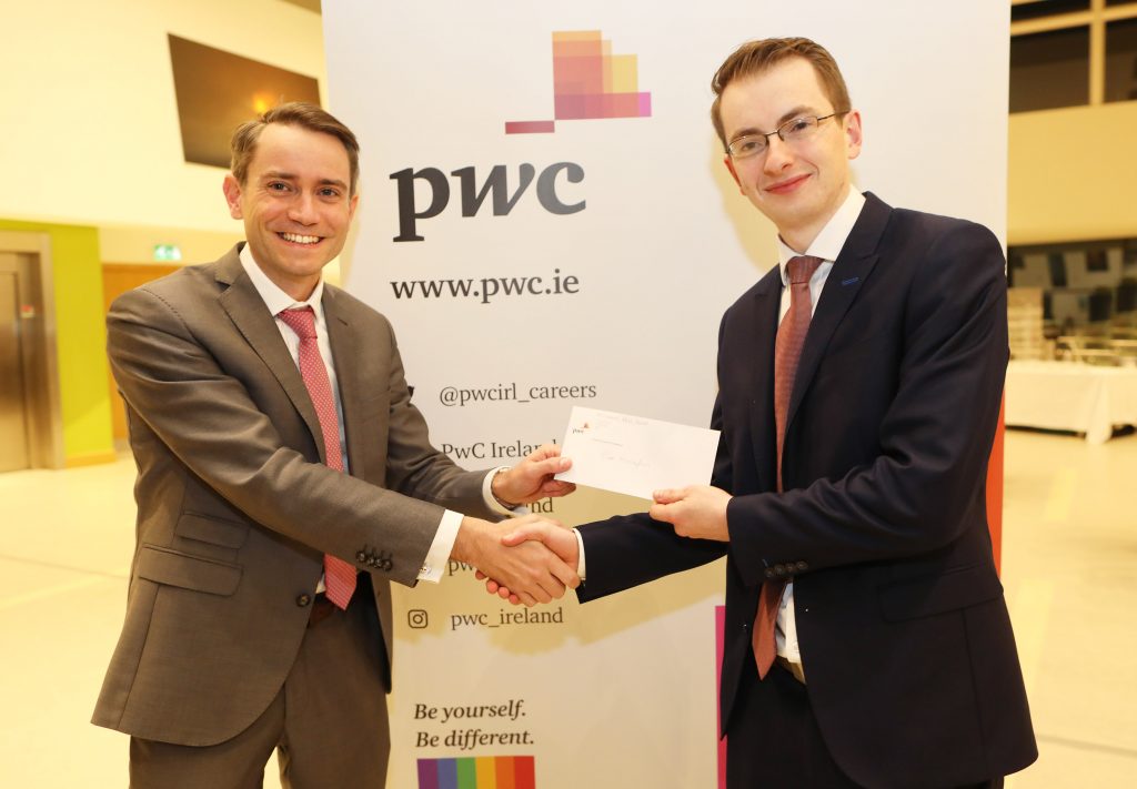 Cian Monaghan receiving the prize for Highest Marks at Part 3 Professional Advice from Colm O’Callaghan, Partner, PwC.