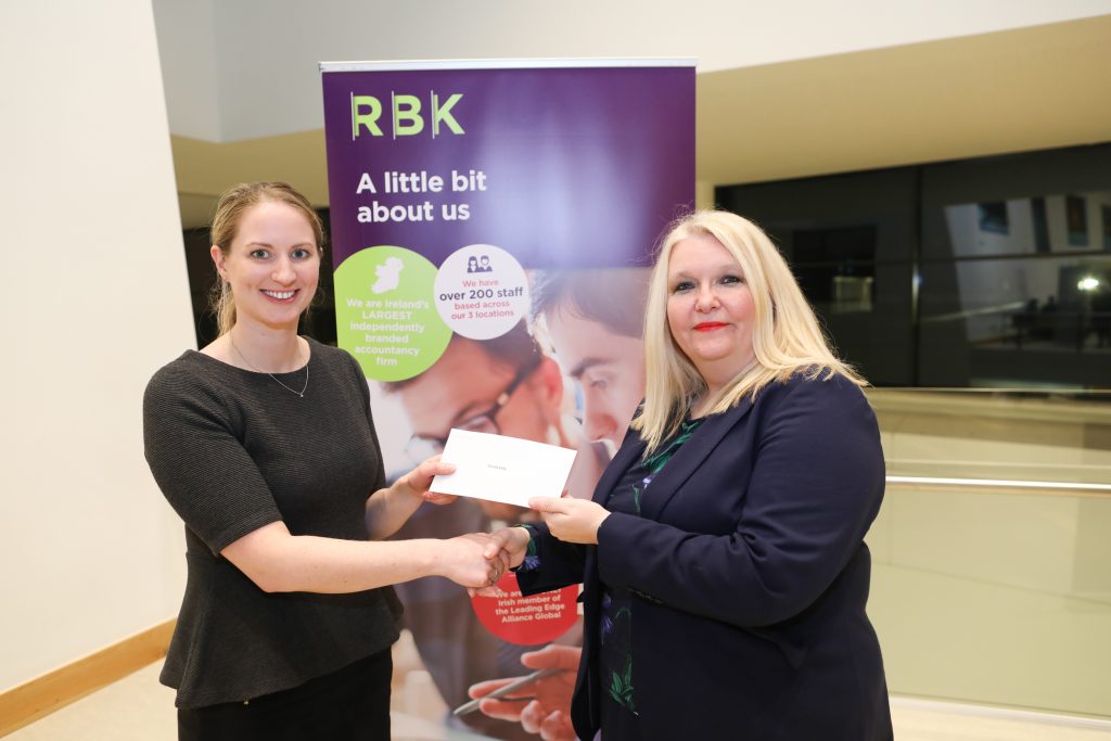 Cecilia Kelly receiving the prize for outstanding marks at Part 1 from Sinead McMahon, Senior Tax Manager, RBK.